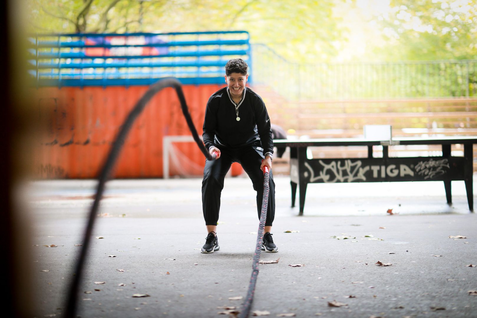 Coach Doaa is working out with the battle ropes.